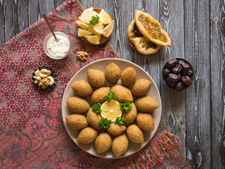 Arabic meat appetizer Kibbeh. Traditional Arabic kibbeh with lamb and pine nuts