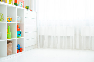 Copy the space of an empty wall in a simple children's room with a white wooden floor and a large...