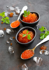 Red caviar on a black background