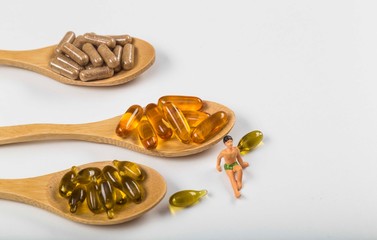 Naklejka premium pills and multivitamins .Healthy supplements on white backgrund