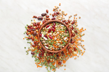 Bowl with different legumes on  table