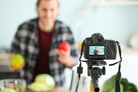 Food blogger recording video at home