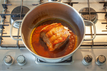 roasted pork in a pot on the cooker