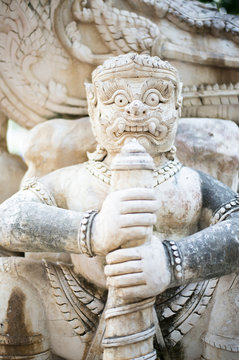picture The statue of an Asian style sculpture that is aged