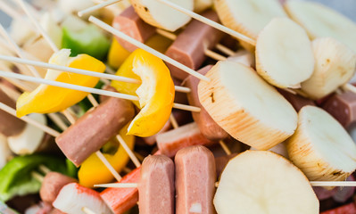barbecue bbq vegetables and sausage skewers closeup view