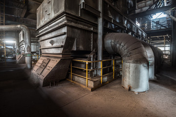 Fototapeta na wymiar Interior of an old abandoned industrial steel factory