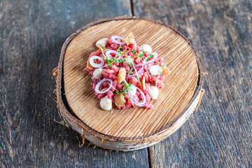 Steak Tartare on wooden plate