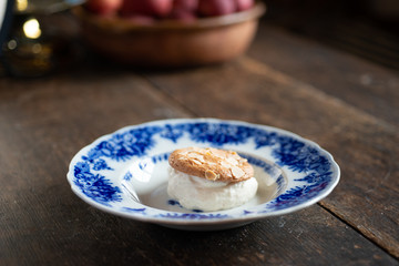 Chef plating dessert in a country kitchen