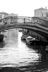 bridge with boat and gondola, venice, burano in italy