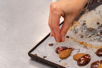Detail of tea pasta, with chocolate and decoration of colored sugar hearts.