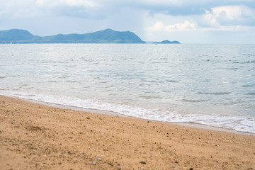 Background image of a beautiful sea horizon with clouds above it in Thailand.