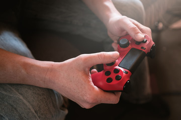 playing video game. gamepad controller in hands.