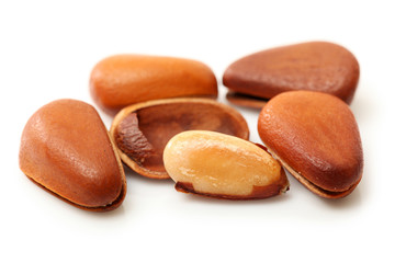 Pine nuts on white background 