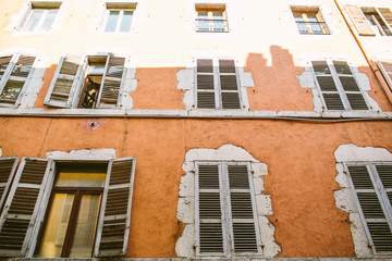 Old city scene: windows with vintage wooden shutters