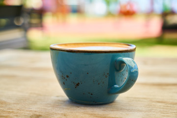 Delicious latte coffee on the wooden table