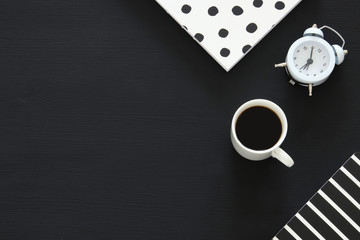 office supplies over black office desk table. Top view