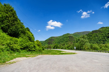 asphalt road passes through a mountain gorge