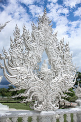 Fototapeta na wymiar CHIANG RAY, THAILAND - 15.05.2019 / The white templo of Wat Rong Khun, northern of Chiang Mai in Thailand