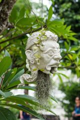 Obraz premium Scary masks hanging on trees at Wat Rong Khun - The White Temple