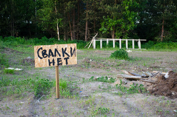 Fototapeta premium Shield with the words 'no landfill' on the cleared landfill site