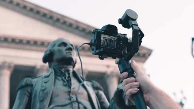 Camera man focusing on the washington statue with his sony a7iii mounted on a gimbal