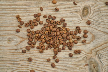 Roasted coffee beans on the wooden table