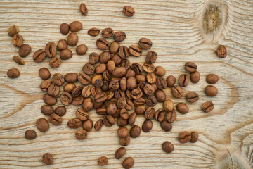 Roasted coffee beans on the wooden table