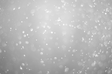 Bokeh background and bubbles reflecting black and white light