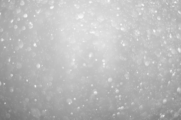 Bokeh background and bubbles reflecting black and white light