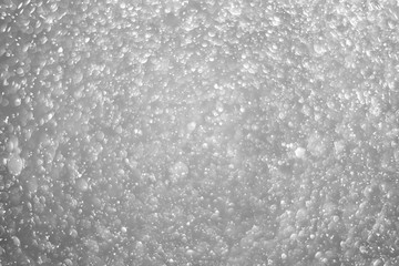 Bokeh background and bubbles reflecting black and white light