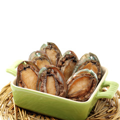 Raw abalones on the white background 