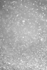 Bokeh background and bubbles reflecting black and white light