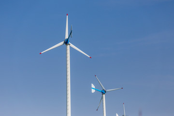 Fototapeta premium wind turbine against blue sky
