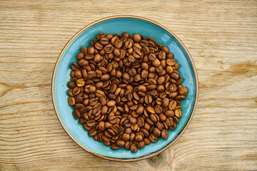 Roasted coffee beans on plate