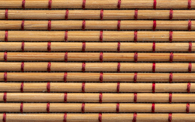 Sticks of bamboo twisted red thread
