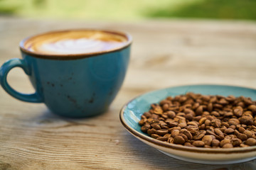 Latte coffee, coffee beans on the table