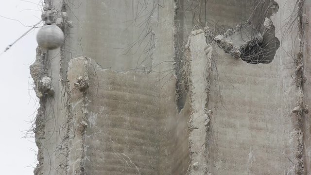 Wrecking Ball Smashing into Building Wall