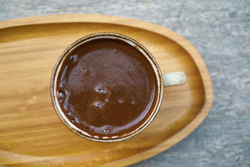 Delicious Turkish coffee on wooden dish