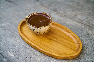 Delicious Turkish coffee on wooden dish
