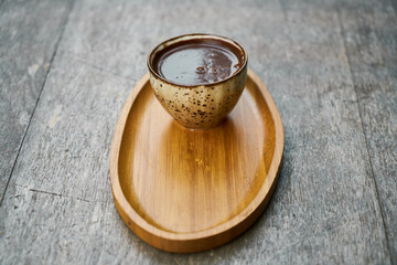 Delicious Turkish coffee on wooden dish