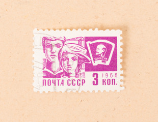 CCCP - CIRCA 1966: A stamp printed in the CCCP shows a man and a woman, circa 1966