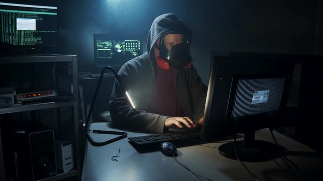 Bio-Terrorist types in computer code wearing a gas mask.