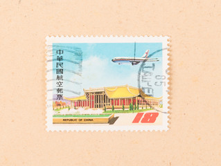 CHINA - CIRCA 1970: A stamp printed in China shows a building and an airplane, circa 1970