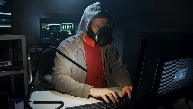Bio-Terrorist types in computer code wearing a gas mask.