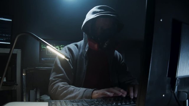 Bio-Terrorist types in computer code wearing a gas mask.