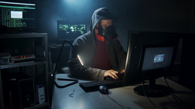 Bio-Terrorist hacker types computer code.