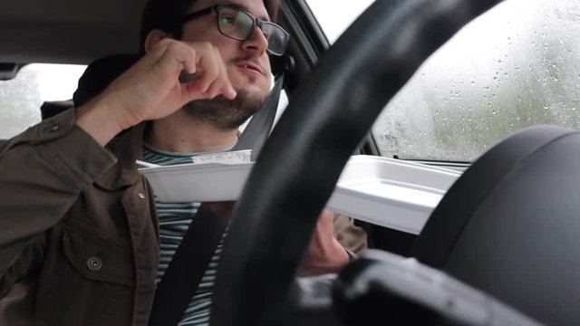 Slow Motion Man Eating Take Away In His Car Alone, Looking Out, Rainy Day