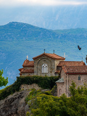 Fototapeta na wymiar The St. Stephen's Monastery and beautiful landscapes of Meteora and blue sky, Kalambaka, Greece
