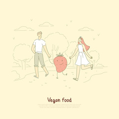 Young vegan couple, husband and wife on outdoor stroll with cute strawberry, surreal vegetarian lifestyle banner