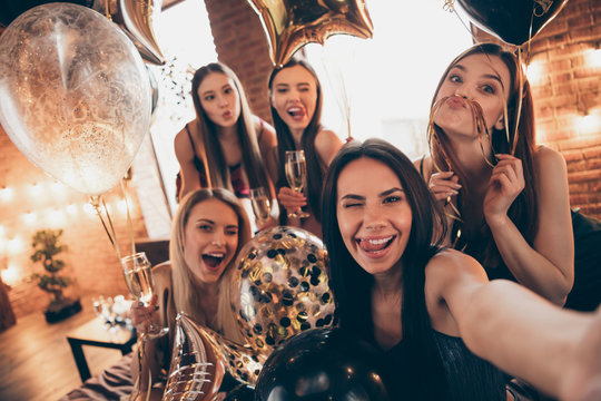 Close up photo beautiful five she her chic ladies little drunk clink wineglasses beverage tongue out mouth funny make take selfies speak talk tell skype share news festive night evening room indoors